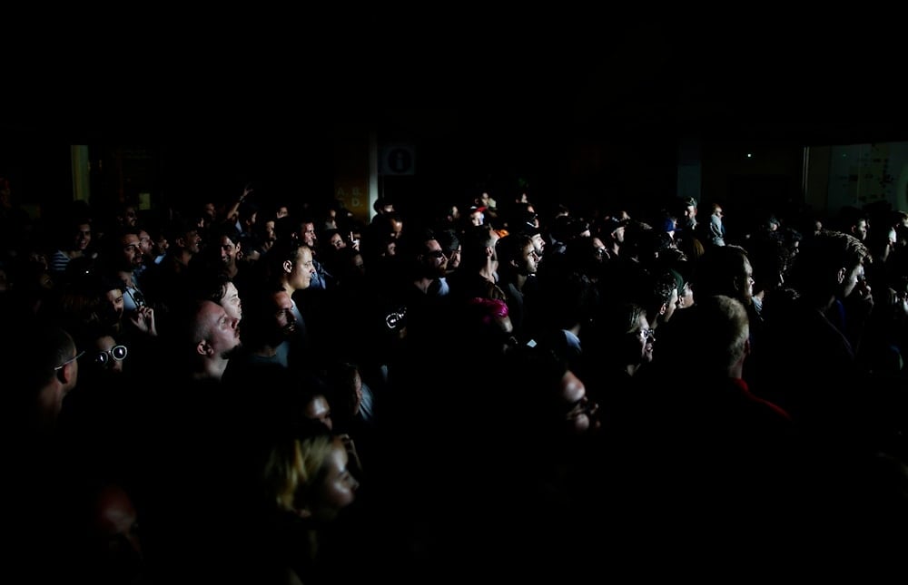 Revellers attend the 24th Advanced Music and Multimedia Art International Sonar Festival in Barcelona, Spain, Thursday, June 15, 2017.