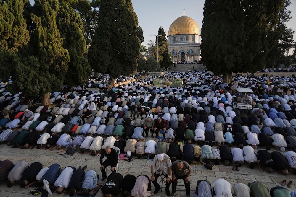 Muslim worshippers offer Eid al-Adha prayers next to the Dome of the Rock shrine at the Al Aqsa Mosque compound in al-Quds, Friday, June 6, 2025. (AP)