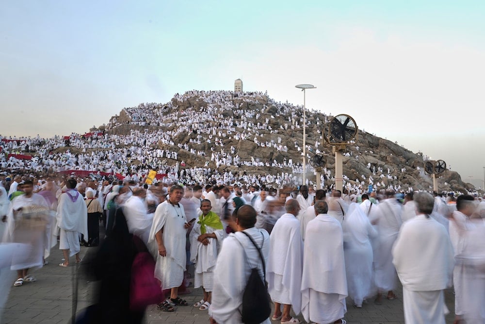 Muslim pilgrims gather on top of the rocky hill known as the Mountain of Mercy, on the Plain of Arafat, during the annual Hajj pilgrimage near the holy city of Mecca, Saudi Arabia, on June 5, 2025. (AP Photo/Amr Nabil)