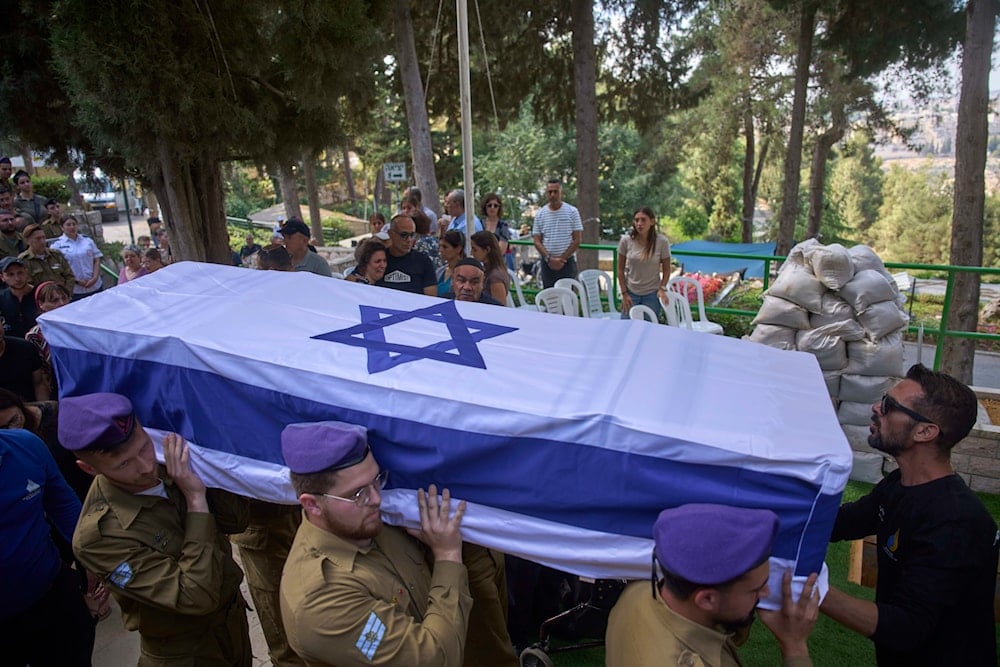  Israeli soldiers carry the flag-draped casket of Sgt. Omer Van Gelder, who was killed in a battle in the Gaza Strip, during his funeral at the Mount Herzl military cemetery in Jerusalem, Tuesday, June 3, 2025 (AP)