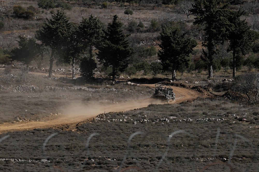An Israeli armoured vehicle crosses the security fence moving towards the so-called Alpha Line that separates the Israeli-controlled Golan Heights from Syria, in the town of Majdal Shams, on December15, 2024. (AP Photo/Matias Delacroix)