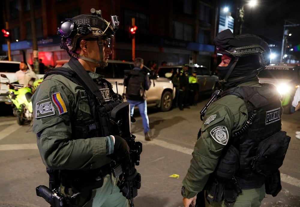 Police stand guard outside the Medicentro hospital where Colombian senator and presidential candidate Miguel Uribe Turbay is being treated after he was shot during a campaign rally in Bogota, Colombia, Saturday, June 7, 2025 (AP)