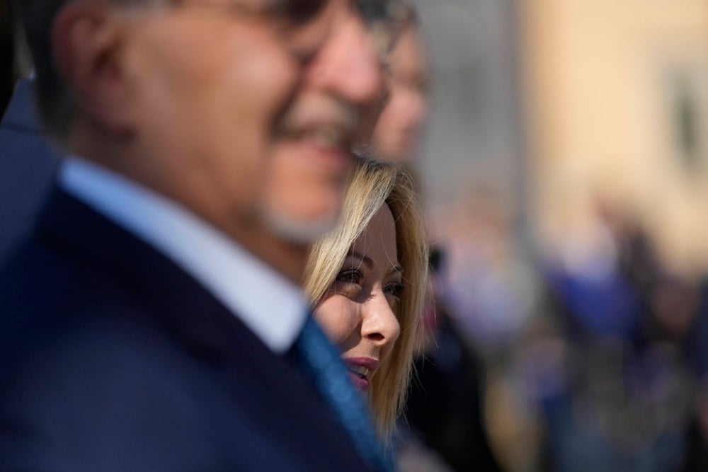 Italian Premier Giorgia Meloni, right, arrives for the celebration of Republic Day in Rome, Friday, June 2, 2023 (AP)