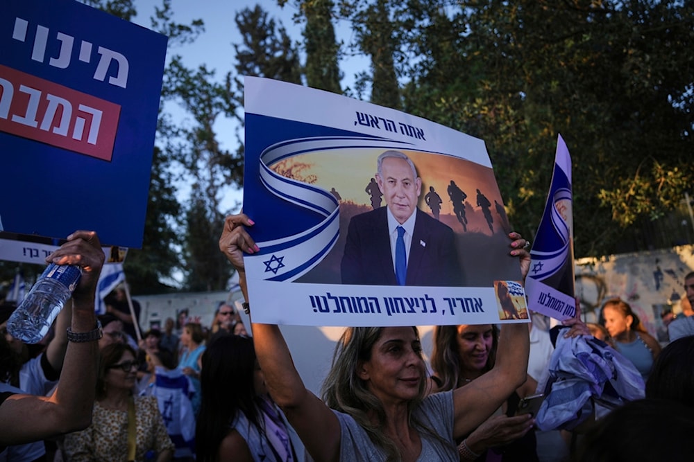 Israelis attend a rally supporting Prime Minister Benjamin Netanyahu, outside the Knesset, the Israeli parliament in occupied al-Quds, Thursday, June 5, 2025 (AP)