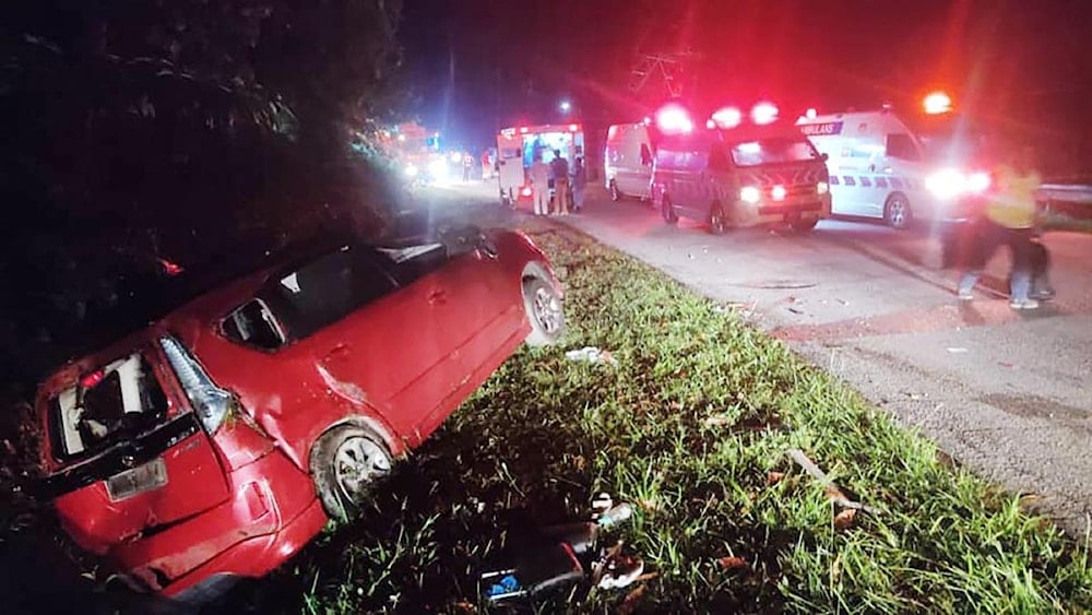 This handout photo taken and released by Perak’s Fire and Rescue Department on June 9, 2025 shows a minivan after it collided with a bus in Gerik-Jeli, in Malaysia’s Perak state (Photo Credit: AFP)