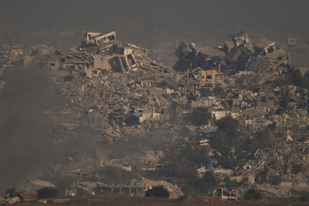 Buildings that were destroyed during the Israeli ground and air operations stand in northern of Gaza Strip as seen from southern occupied Palestine, Thursday, July 10, 2025. (AP Photo/Leo Correa)