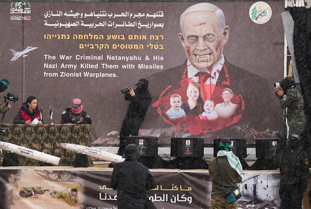 Hamas fighters hand over coffins containing four bodies to the Red Cross in Khan Younis, southern Gaza Strip, for return to Israel, Thursday, Feb. 20, 2025. (AP)