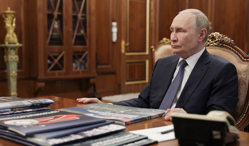 Russian President Vladimir Putin listens to Belgorod Region Governor Vyacheslav Gladkov during their meeting at the Kremlin in Moscow, Russia, Friday, July 11, 2025. (via AP)