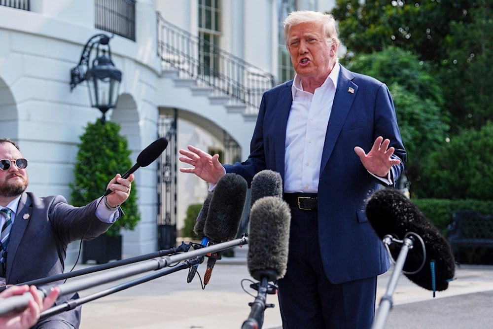 President Donald Trump speaks with reporters before departing the White House, Friday, July 11, 2025, in Washington. (AP Photo/Evan Vucci)