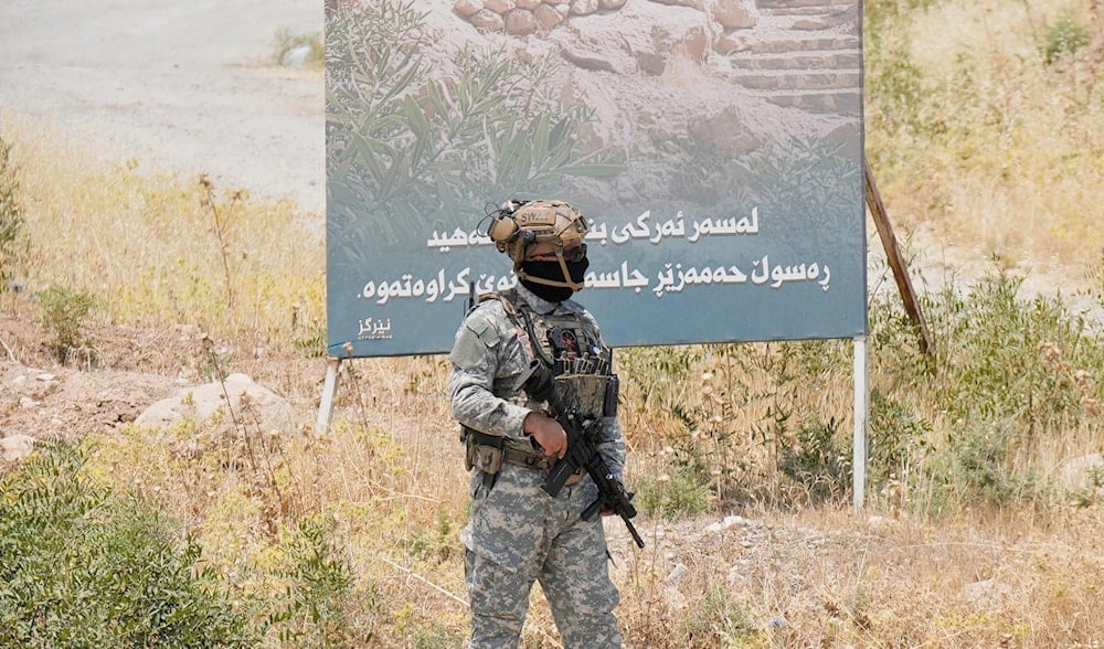 Forces of the regional Kurdish administration secure the area of the Jasana Cave ahead of a symbolic disarmament ceremony by the separatist PKK group as part of the peace process with Turkey, in Sulaymaniyah governorate, Iraq, July 11, 2025. (AP)