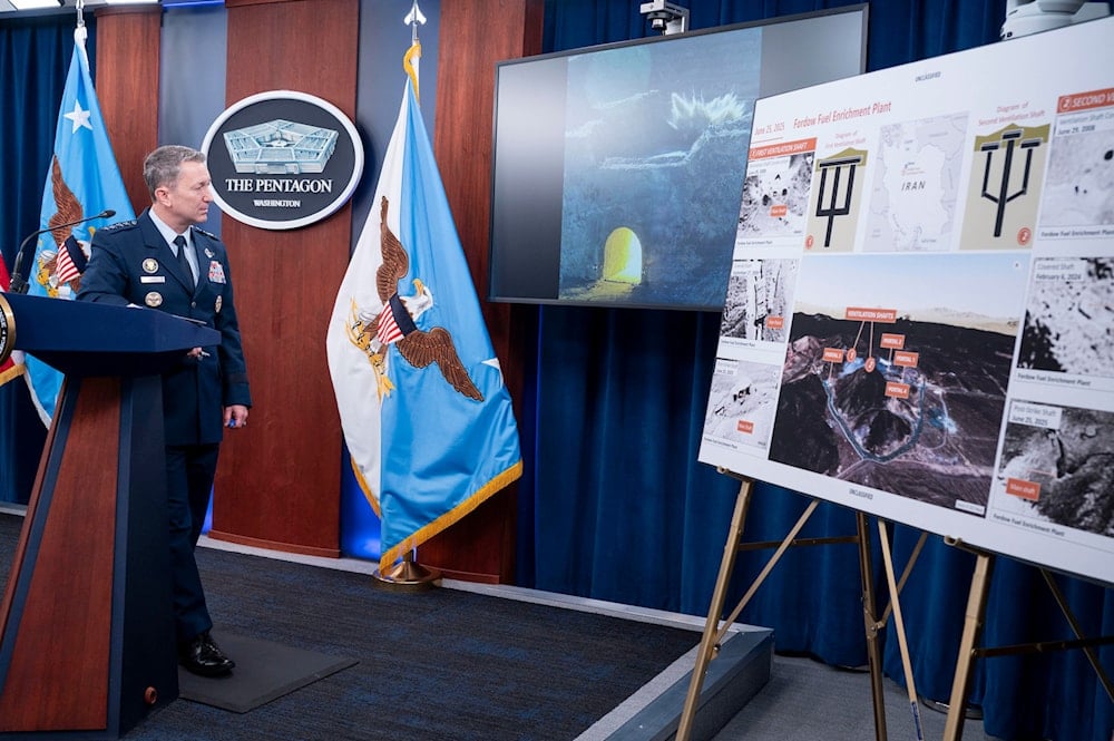 Joint Chiefs Chairman Gen. Dan Caine watches a test video of the ordinance used in the attack on the Iranian Fordow Fuel Enrichment Plant during a news conference at the Pentagon, Thursday, June 26, 2025 in Washington (AP)