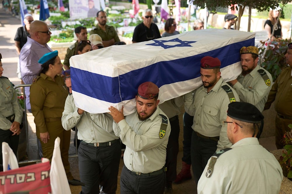 Israeli Occupation Forces carry the coffin of Israeli reserve soldier Sergeant first class Benyamin Asulin ,28, who was killed in a battle in the Gaza Strip, Tuesday, July 8, 2025 (AP)