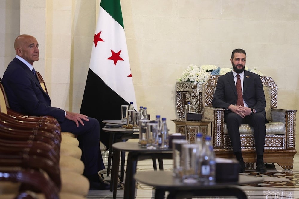 Syria's interim president, Ahmad al-Sharaa, right, meets with U.S. Ambassador to Turkey and Special Envoy to Syria Tom Barrack at the People's Palace in Damascus, Syria, Wednesday, July 9, 2025 (AP)