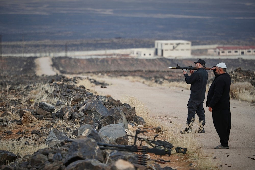 A Druze militiaman holds a small rocket launcher during a shooting practice in the southern province of Sweida, Syria, March 4, 2025 (AP)