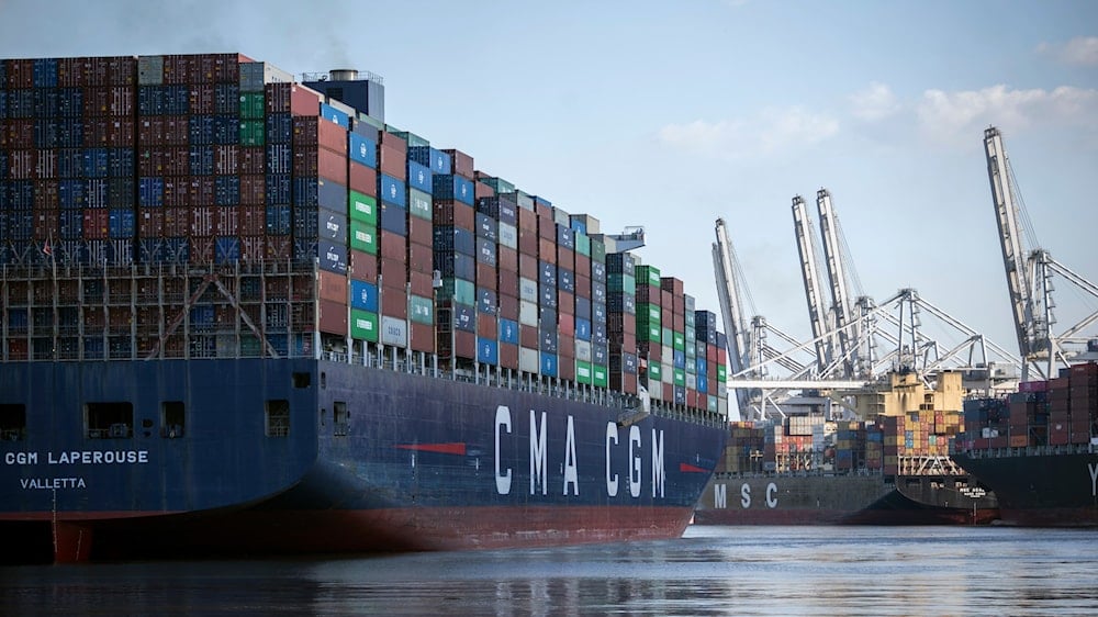 The container ship CMA CGM Laperouse, left, docks at the Georgia Ports Authority's Port of Savannah, Sept. 29, 2021, in Savannah, Ga (AP)