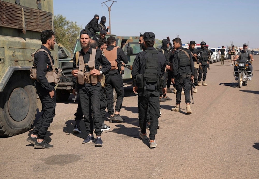 Syrian government security forces gather on the outskirts of Sweida province where clashes erupted between Druze and Bedouin clans, southern Syria, Monday, July 14, 2025 (AP)