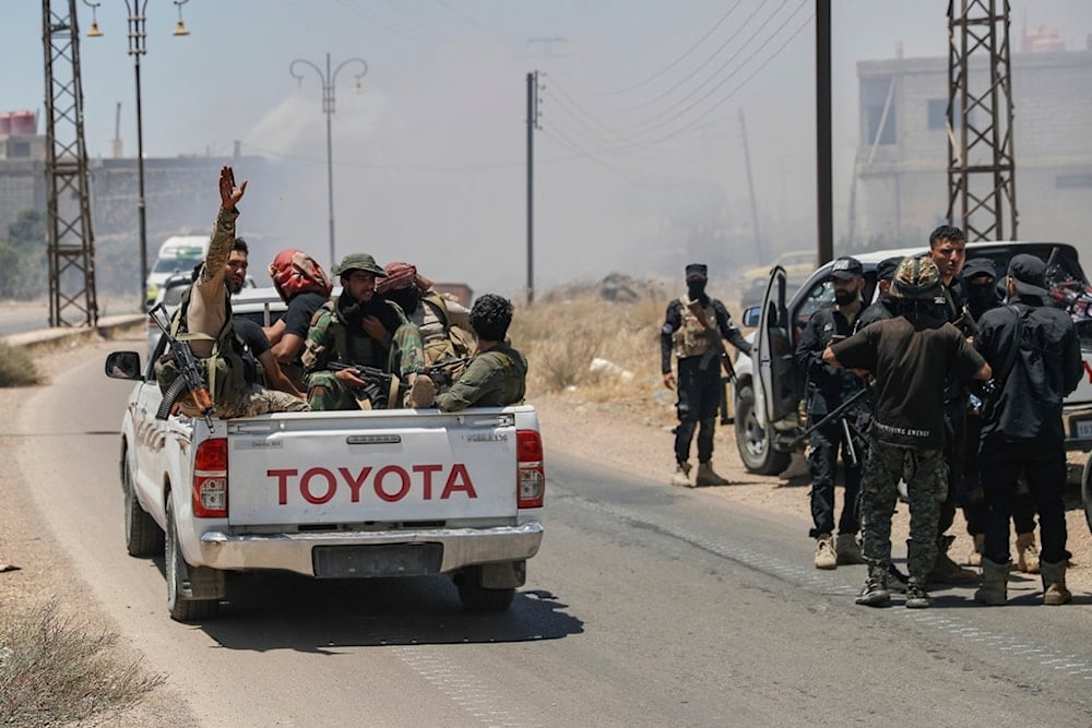 Syrian government forces gather at Mazraa village on the outskirts of Sweida city, southern Syria, Tuesday, July 15, 2025 (AP)