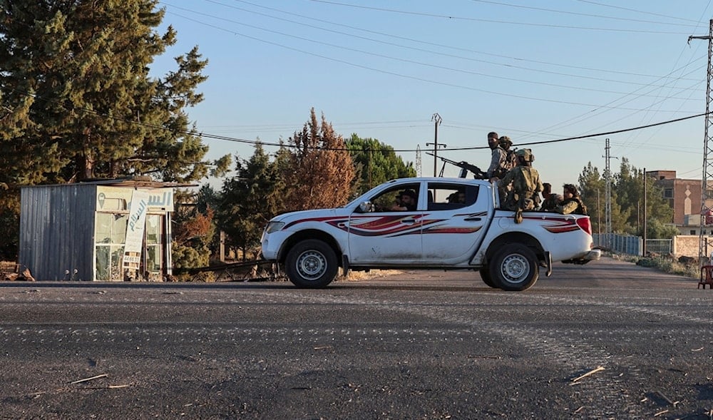 Syrian government forces deploy at Mazraa village on the outskirts of the city of Sweida, where clashes erupted between Sunni Bedouin clans and Druze militias, southern Syria, Monday, July 14, 2025. (AP)