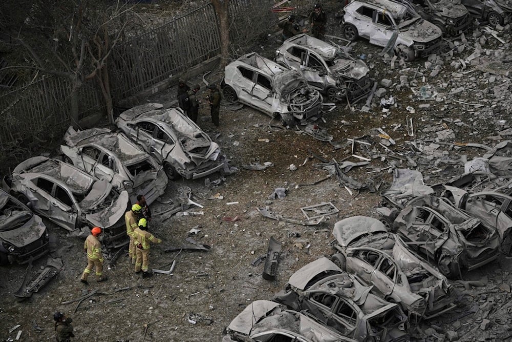 Firefighters inspect the site struck by an Iranian missile strik in Beersheba, occupied Palestine, on Tuesday, June 24, 2025. (AP Photo/Leo Correa)