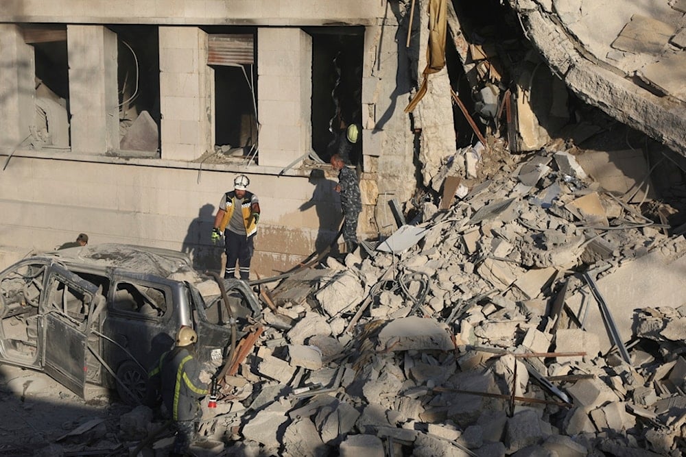 Civil defense workers inspect the Syrian Defense Ministry building, heavily damaged after Israeli airstrikes in Damascus, Syria, Wednesday, July 16, 2025 (AP)