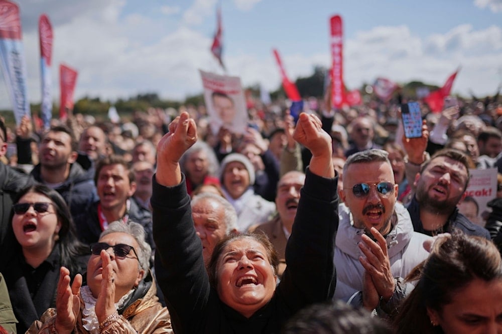 Supporters chant slogans as they gather outside Silivri Prison, where a hearing is taking place for Istanbul Mayor Ekrem Imamoglu in one of multiple cases against him, west of Istanbul, Turkey, Friday, April 11, 2025 (AP)