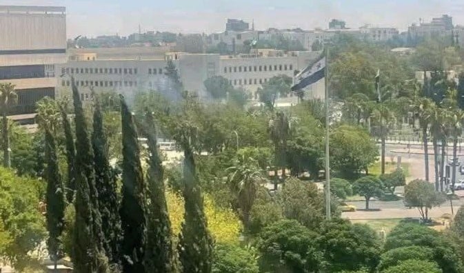 Smoke rises after and Israeli drone launched an airstrike on the entrance of the Syrian Ministry of Defense, Damascus, Syria, July, 16, 2025 (social media)