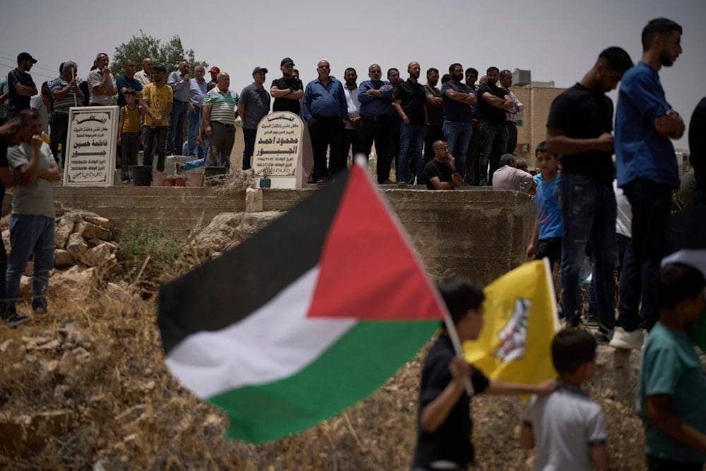 Mourners attend the funeral of the Palestinian teenager Amjad Nassar Awad Hawshiya, 15, who was killed in an Israeli raid, in the West Bank village of Yatta, south of al-Khalil, Tuesday, July 1, 2025 (AP)