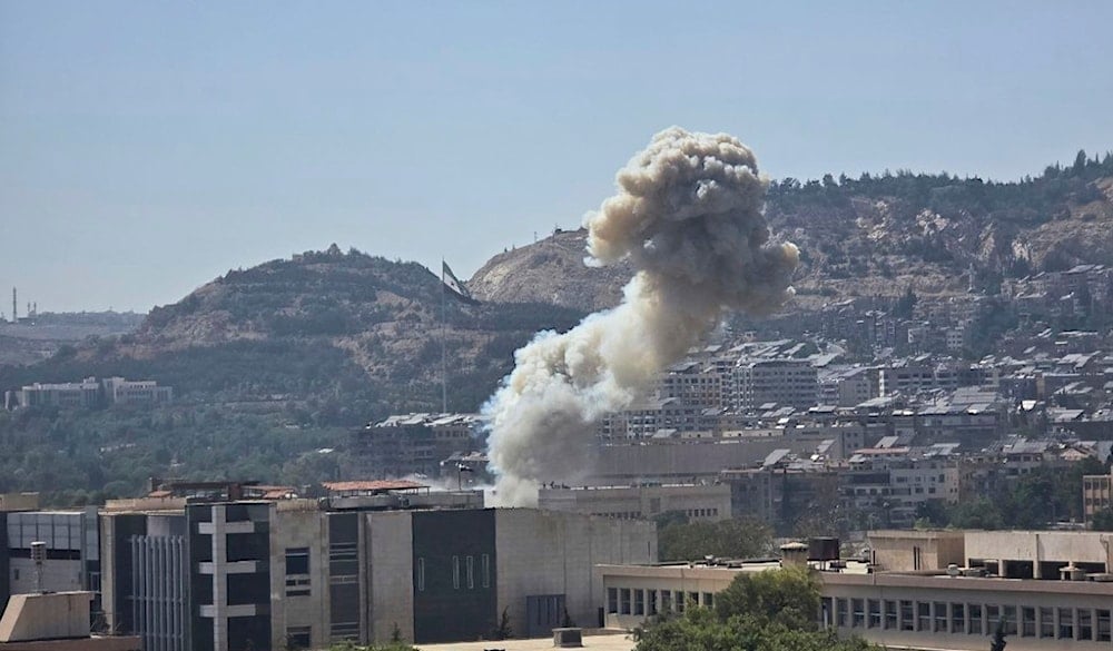 In this photo released by the Syrian official news agency SANA, smoke rises from an Israeli airstrike that hit the Syrian Defense Ministry in Damascus, Syria, Wednesday, July 16, 2025 (AP)