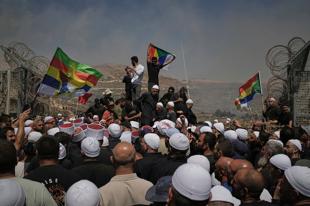 Druze from Syria protest in the Israeli-occupied Majdal Shams of the occupied Golan Heights, Wednesday, July 16, 2025 (AP)
