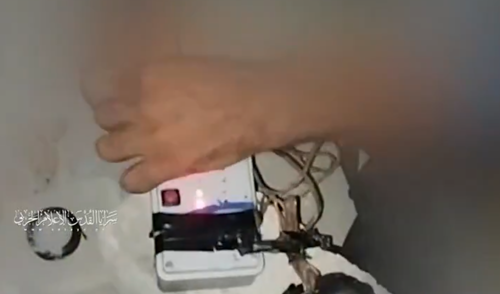 An al-Quds Brigades fighter activating an explosive device before an operation, Gaza, July 17, 2025 (Military Media)