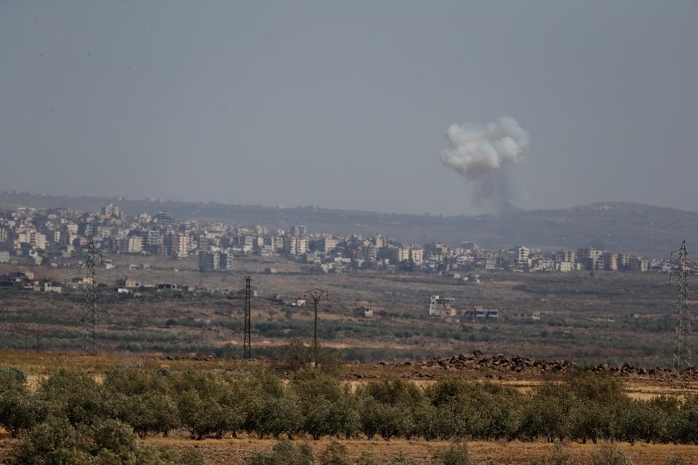 Smoke rises from clashes between Syrian government forces and Druze militias in Sweida city, southern Syria, Wednesday, July 16, 2025. (AP)
