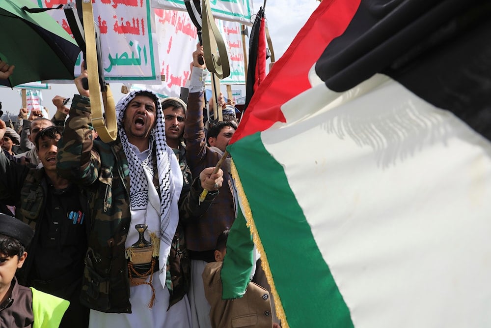 Ansar Allah supporters attend a weekly protest against the US and 