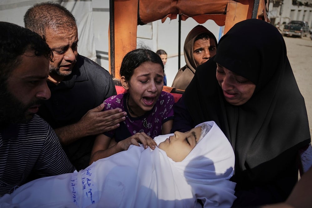 Relatives mourn around the body of Palestinian child Hala Al-Aila who was killed by an Israeli army airstrike on Gaza City, Monday, July 7, 2025. (AP)