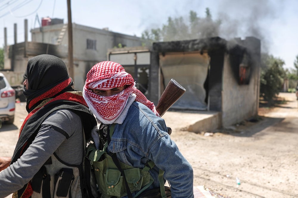Bedouin fighters deploy at Mazraa village on the outskirts of Sweida city, during clashes between the Bedouin clans and Druze militias, southern Syria, Friday, July 18, 2025 (AP)