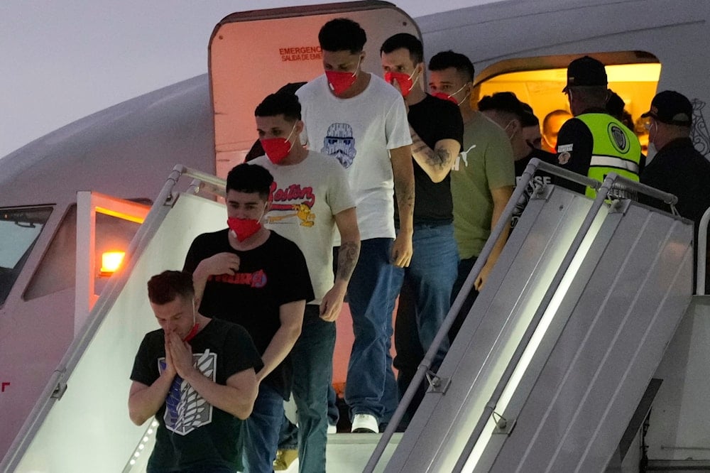 Migrants deported months ago by the United States to El Salvador under the Trump administration's immigration crackdown arrive at Simon Bolívar International Airport in Maiquetia, Venezuela, on July 18, 2025. (AP Photo/Ariana Cubillos)