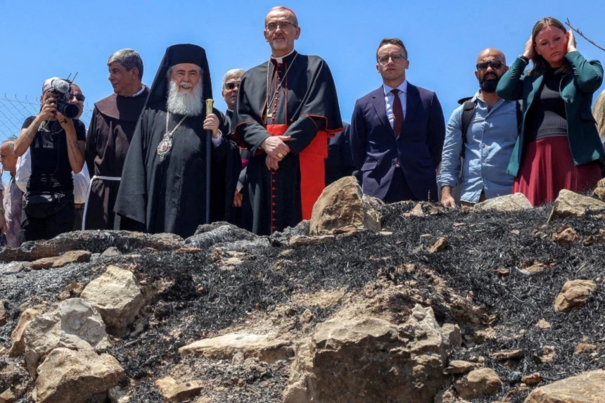 Latin Patriarch of Jerusalem Pierbattista Pizzaballa, center, and other clergymen gather at the Church of St. George Al Khidr on Monday, days after an arson attack at the site reportedly by Israeli settlers. (AFP - Getty Images)