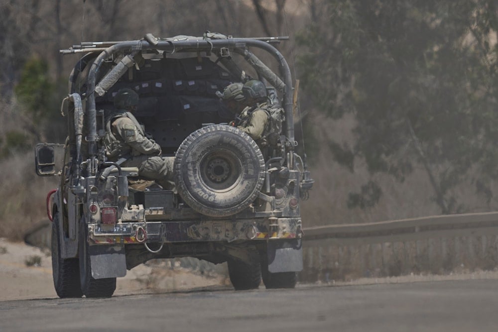 Israeli soldiers drive near the border with the Gaza Strip, Occupied Palestine, Wednesday, July 2, 2025 (AP)