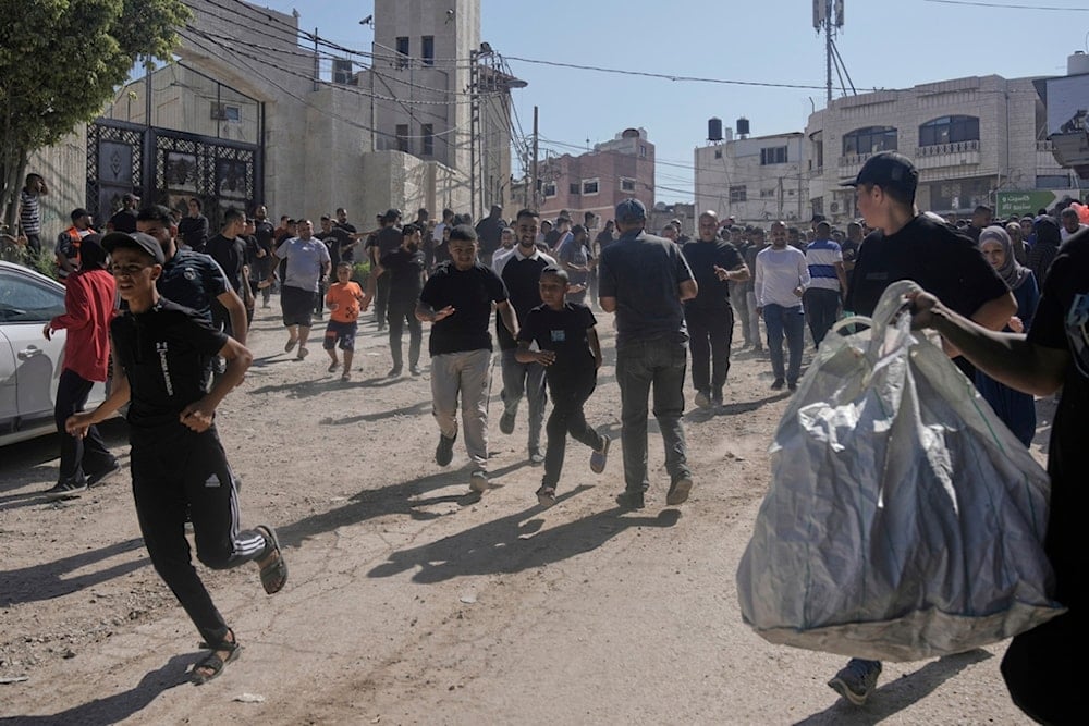 Palestinians gather their belongings ahead of homes demolition by the Israeli occupation forces in the Tulkarm refugee camp, West Bank, Wednesday, July 2, 2025 (AP)