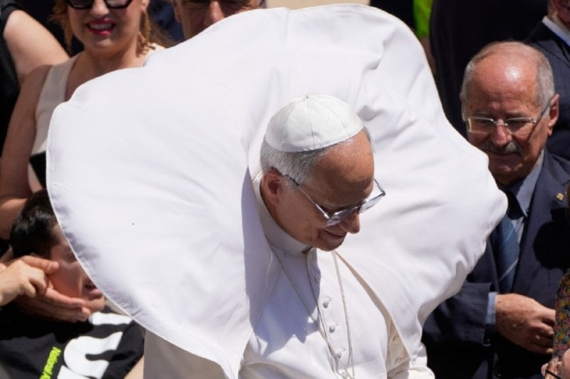A gust of wind blows Pope Leo XIV's mantel at the end of the noon Angelus prayer in the square in front of the Apostolic Palace in Castel Gandolfo, Italy, Sunday, July 20, 2025 (AP)