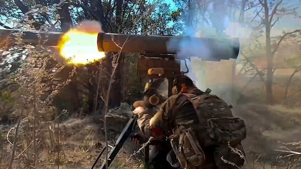 A Russian soldier in an undisclosed location fires an anti-tank missile at Ukrainian forces, Tuesday, September 24, 2024, a (Russian Defense Ministry screengrab)