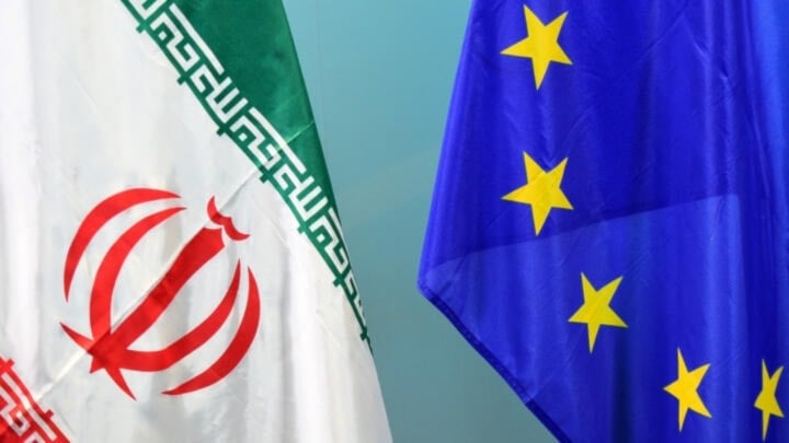 Close up of the Iranian flag (left) and European Union flag (right), undated. (AFP)  