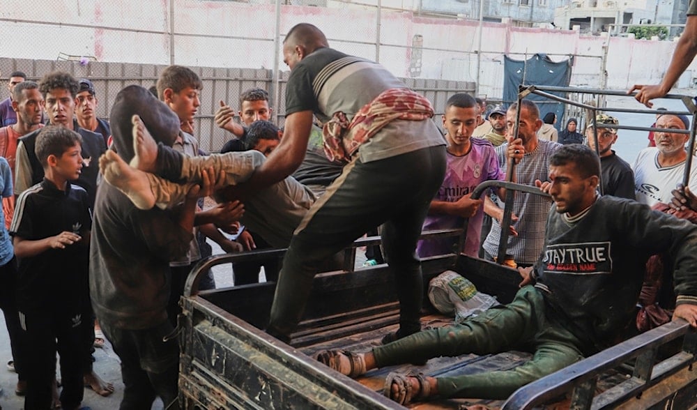 Palestinians who were attacked by IOF during a food distribution at a center run by the Gaza Humanitarian Foundation, are brought to Nasser Hospital in Khan Younis, southern Gaza Strip, July 19, 2025. (AP)