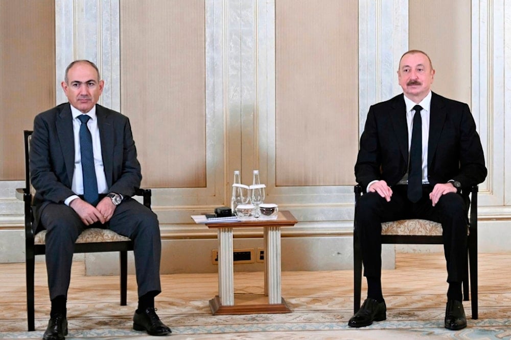 Azerbaijani President Ilham Aliyev, right, and Prime Minister of Armenia Nikol Pashinyan pose for a photo prior to their talks in Abu Dhabi, United Arab Emirates, on Thursday, July 10, 2025,  (Azerbaijan's Presidential Press Office)