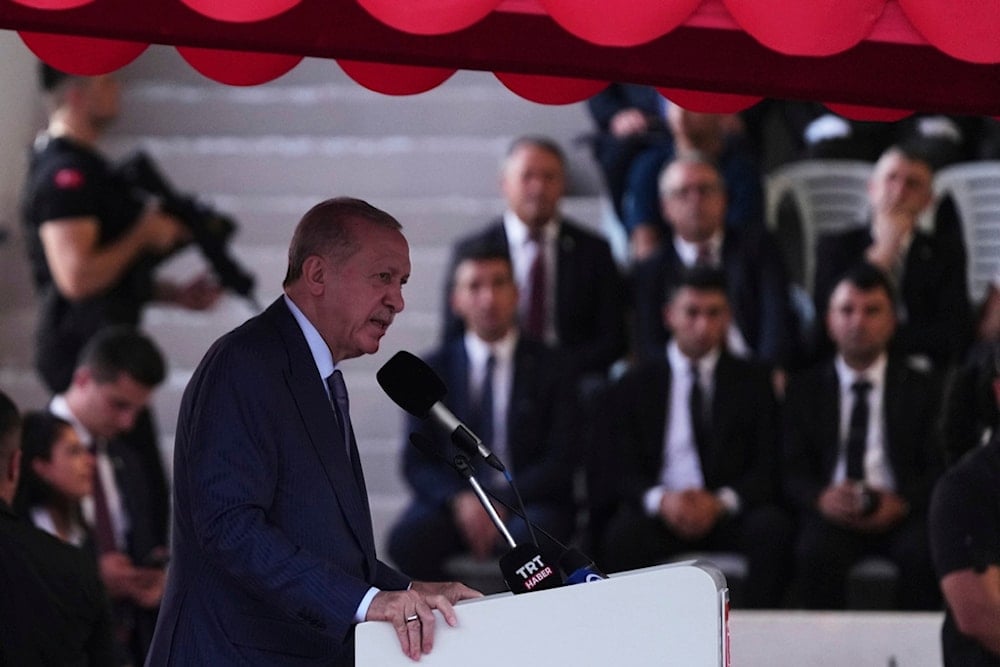 Turkish President Recep Tayyip Erdogan makes a speech during a military parade marking the 51st anniversary of the 1974 Turkish invasion in the Turkish-occupied area, in the divided capital of Nicosia, Cyprus, Sunday, July 20, 2025 (AP)