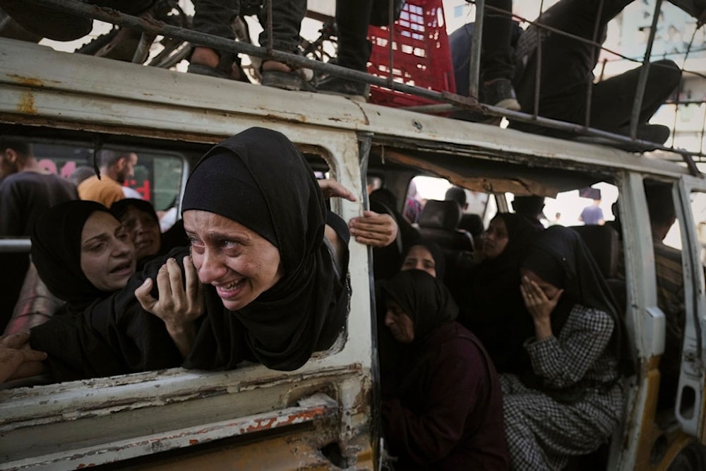 Palestinians mourn their relatives killed in Israeli aggression on Gaza, at Shifa Hospital in Gaza City, Tuesday, July 22, 2025 (AP)