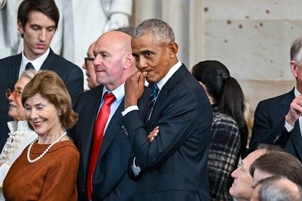 Former President Barack Obama, right, and Laura Bush, left, attend the 60th Presidential Inauguration in the Rotunda of the US Capitol in Washington, Monday, Jan. 20, 2025 (AP)