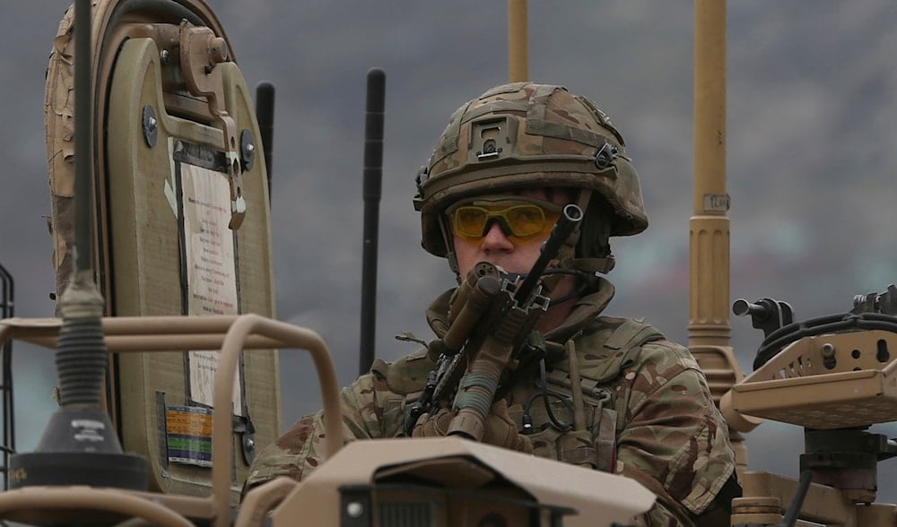 A British soldier with NATO-led Resolute Support Mission forces arrives at the site of an attack in Kabul, Afghanistan, Wednesday, March 25, 2020. (AP)