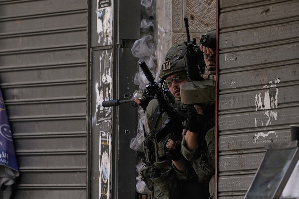 Israeli soldiers take positions during a military raid in the West Bank city of Nablus, Tuesday, June 10, 2025 (AP)