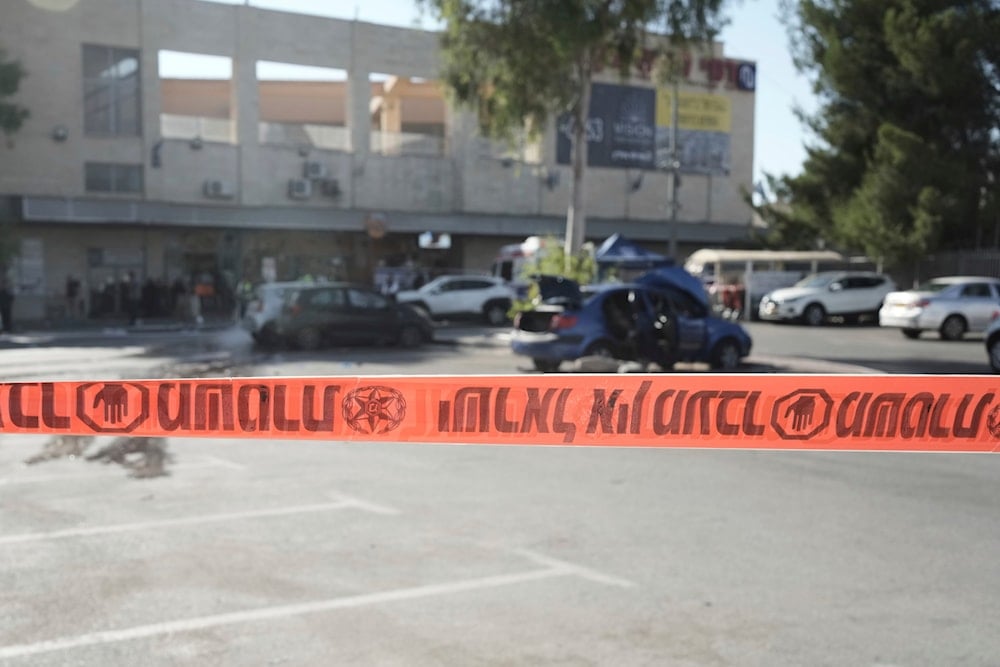 sraeli police crime scene tape blocks off the site of an attack that killed an Israeli man at a shopping center at the West Bank Gush Etzion junction, on July 10, 2025. (AP Photo/Maya Alleruzzo)
