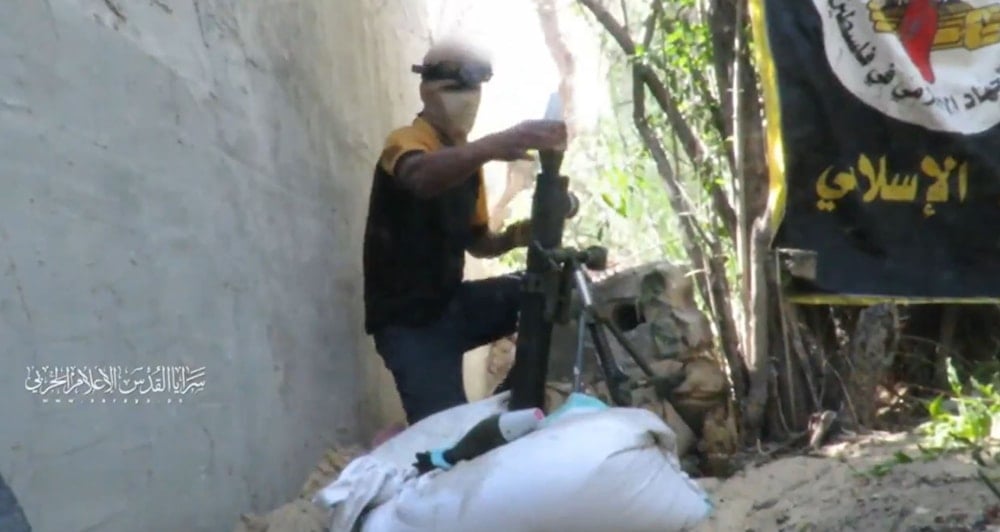 An Al-Quds Brigades fighter loads a mortar round into a launcher, Gaza, Occupied Palestine, July 24, 2025 (Al-Quds Brigades Military Media)